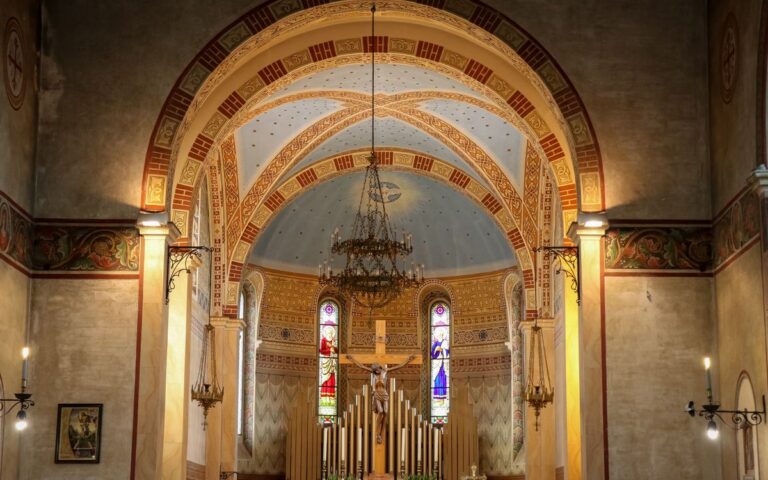 Stunning interior of traditional church in Spresiano, Italy with altar and frescoes.